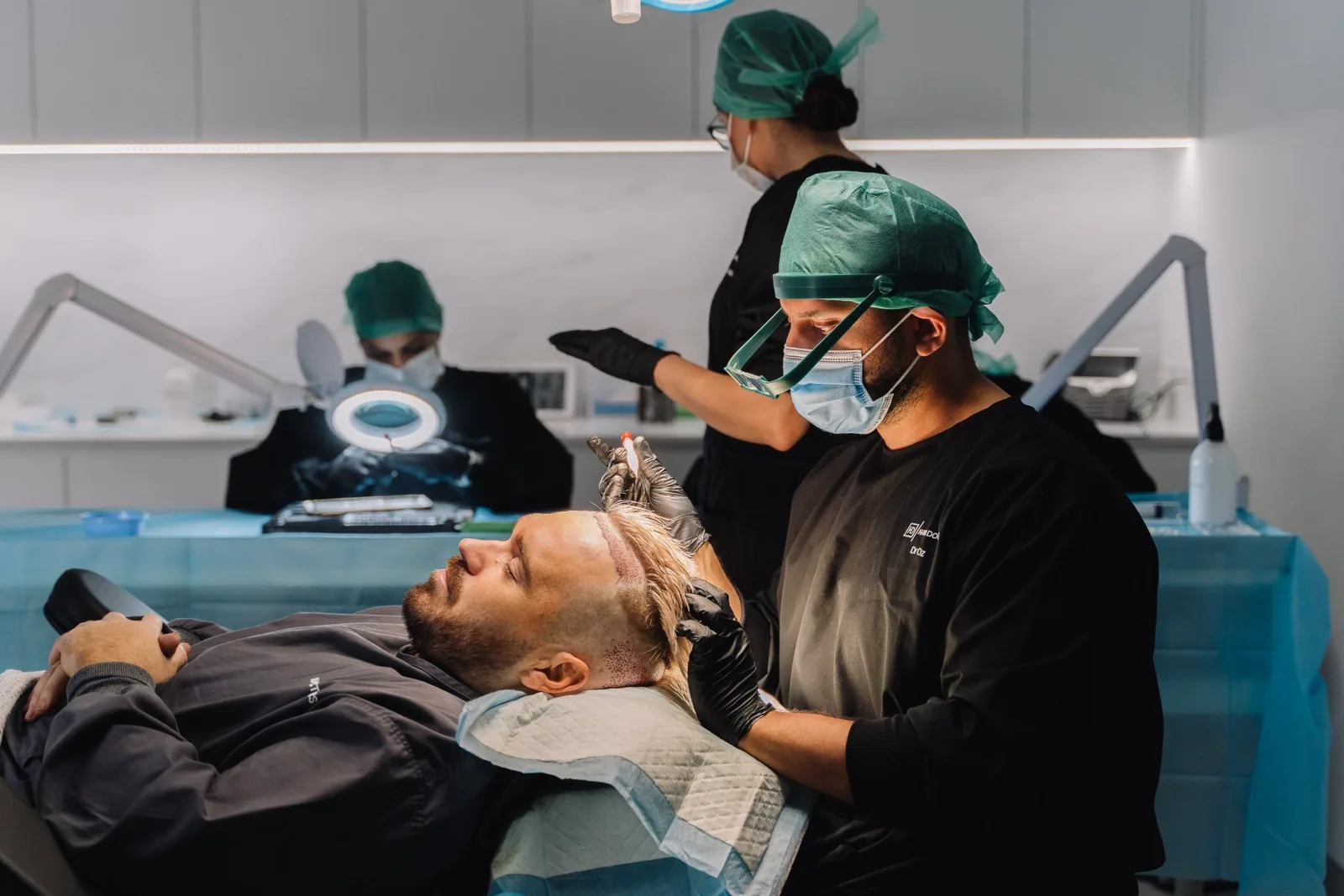 Hair Doctors surgical team placing grafts during a hair transplant in the South Yarra theatre